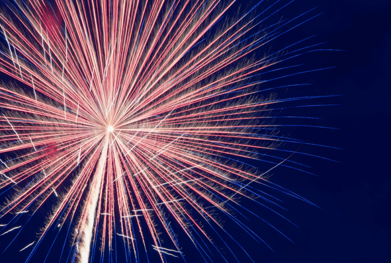 Image is of an exploding firework in the night sky, concept of Fourth of July in Nashville